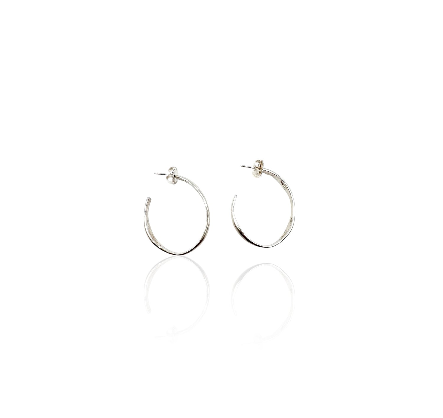 Soul full studio medium silver oval hoops displayed on white background.