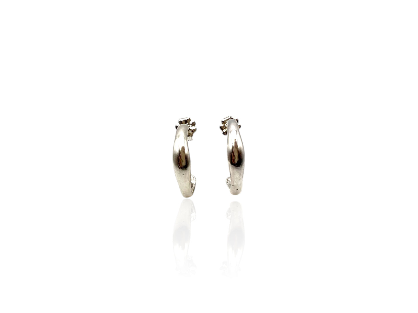 Soul full studio small silver hoops displayed on white background.