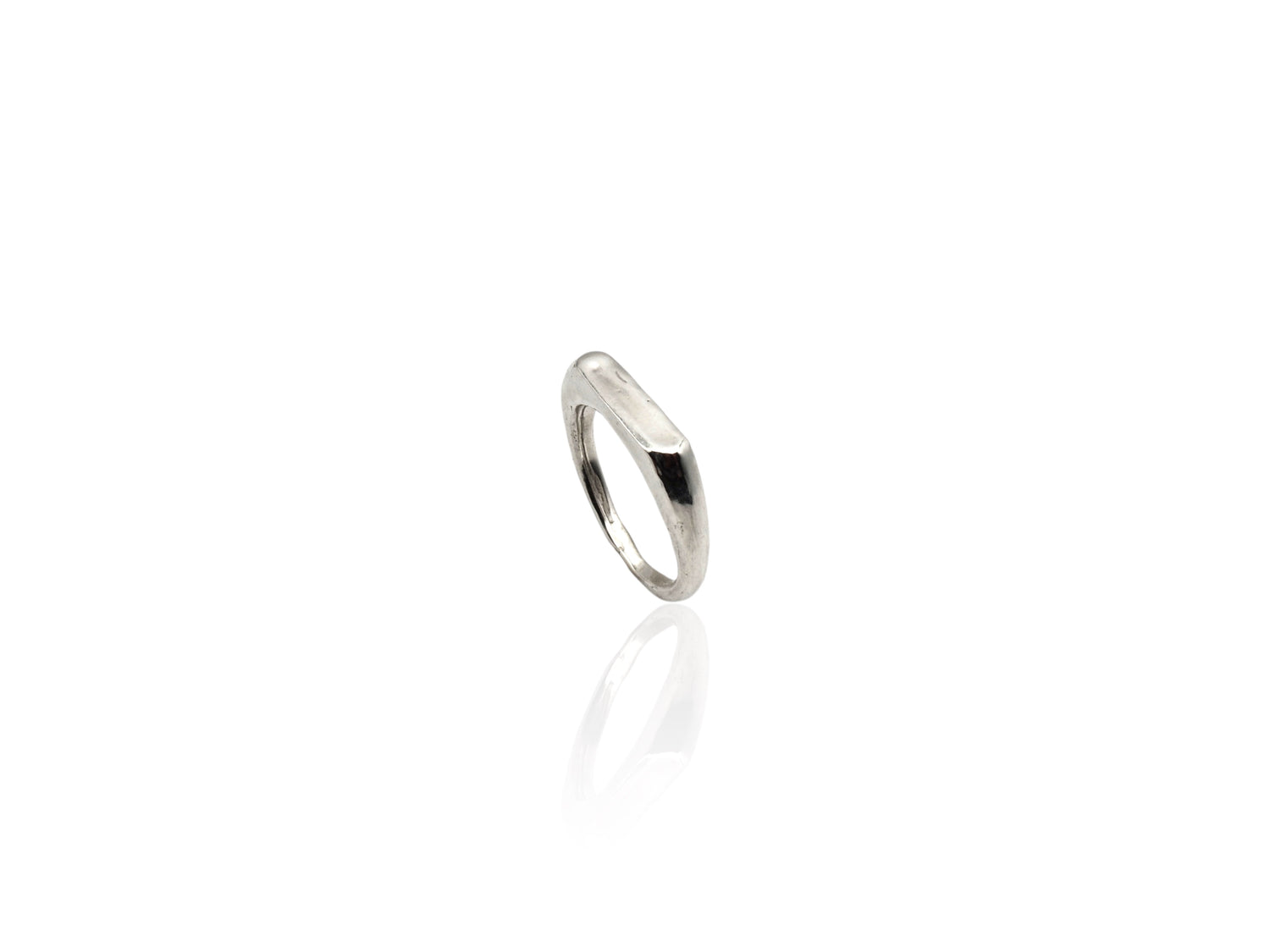 Silver thin signet ring displayed on white background. silver ring with sculpted organic design and texture. Ring is designed by soul full studio and handmade with lost wax casting and metal smithing techniques.