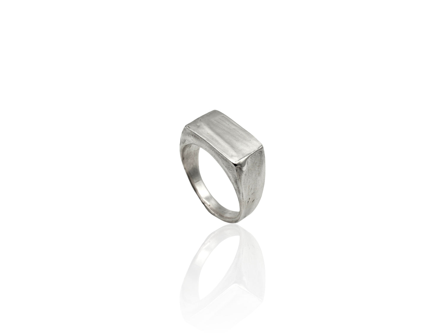 Silver signet ring displayed on white background. silver ring with sculpted organic design and texture. Ring is designed by soul full studio and handmade with lost wax casting and metal smithing techniques.