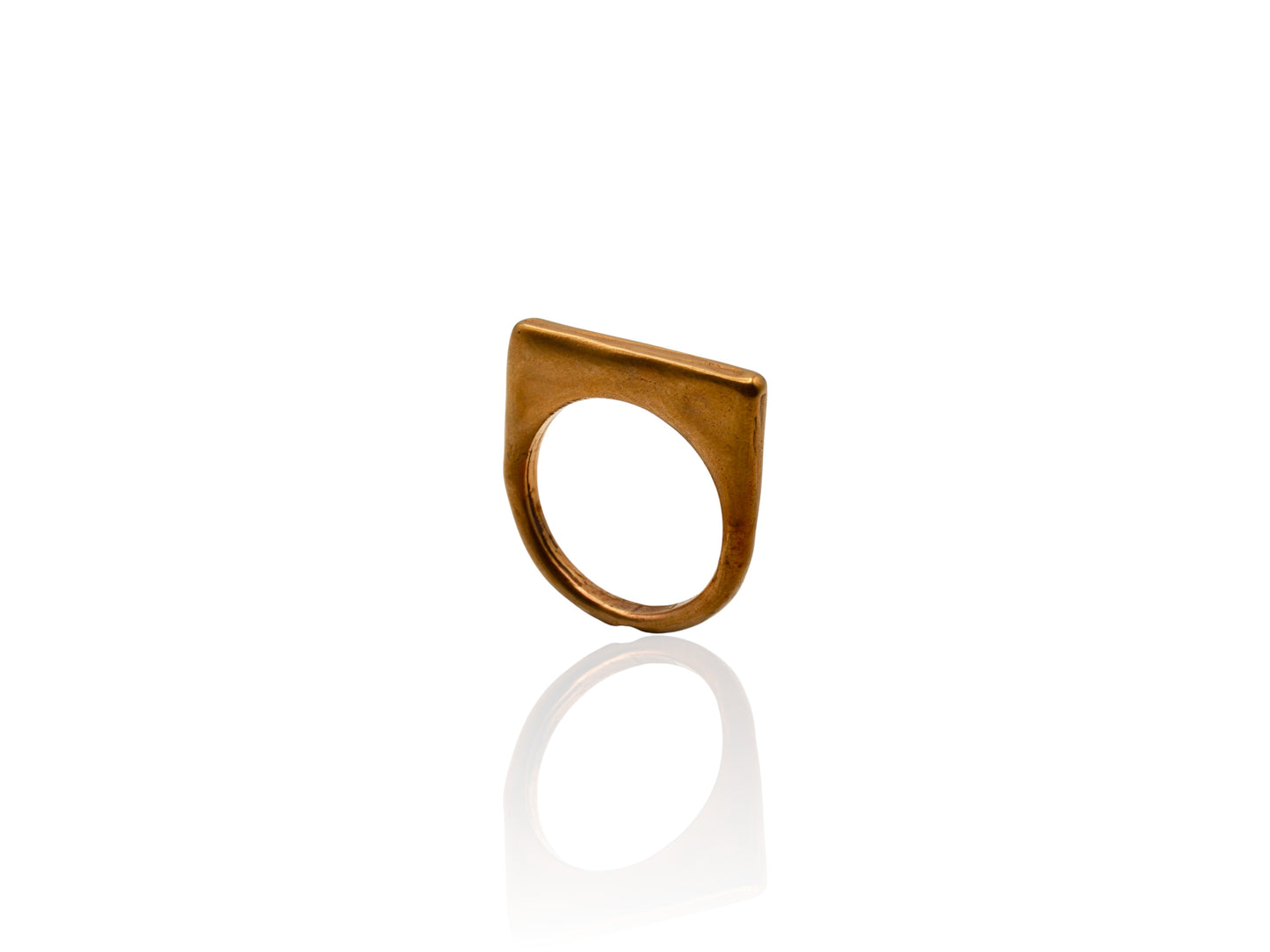 Bronze ring displayed on white background. Bronze ring with sculpted organic design and texture. Ring is designed by soul full studio and handmade with lost wax casting and metal smithing techniques. Jewelry inspired by Georgia Okeefe