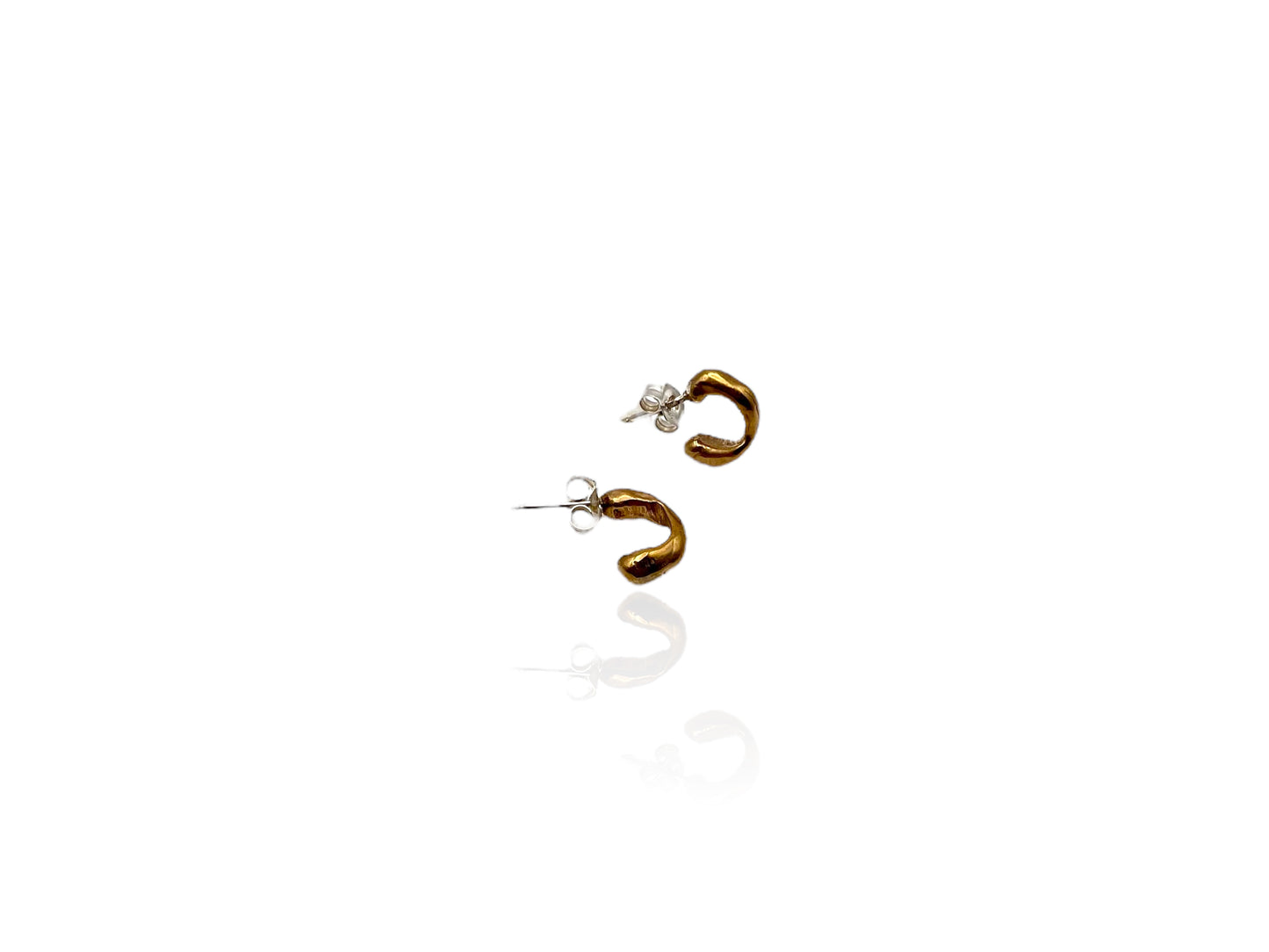 Soul full studio small bronze huggies displayed on white background.