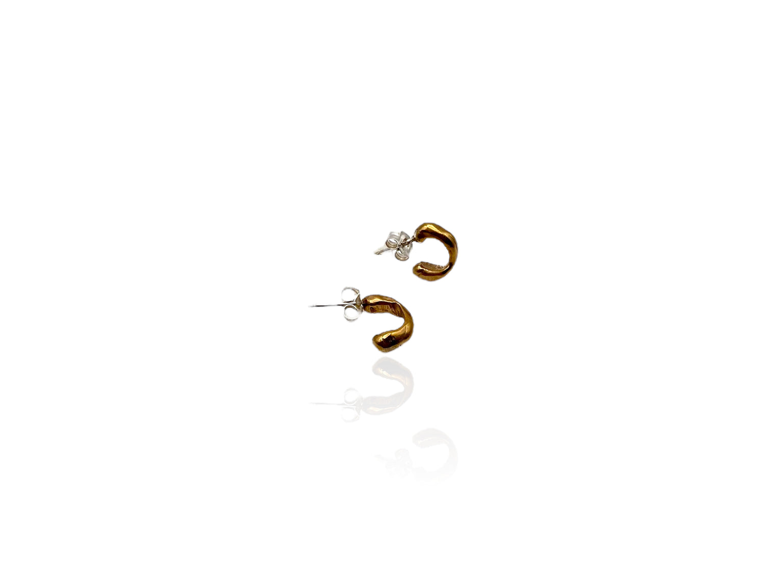 Soul full studio small bronze huggies displayed on white background.