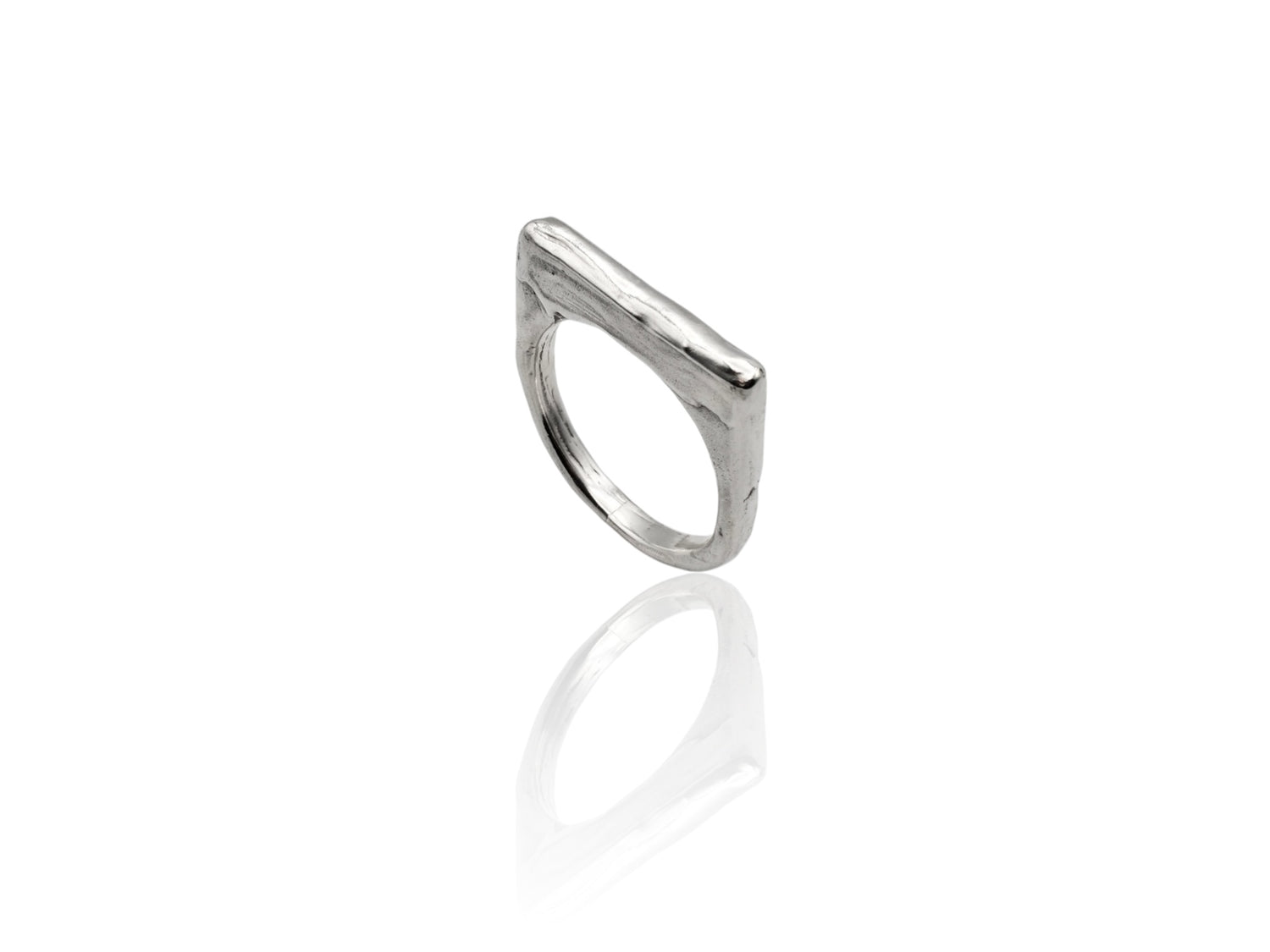 Silver ring displayed on white background. silver ring with sculpted organic design and texture. Ring is designed by soul full studio and handmade with lost wax casting and metal smithing techniques.