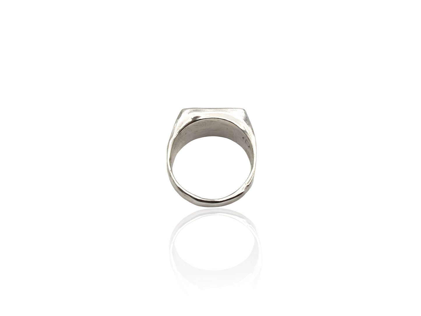 Silver signet ring displayed on white background. silver ring with sculpted organic design and texture. Ring is designed by soul full studio and handmade with lost wax casting and metal smithing techniques.