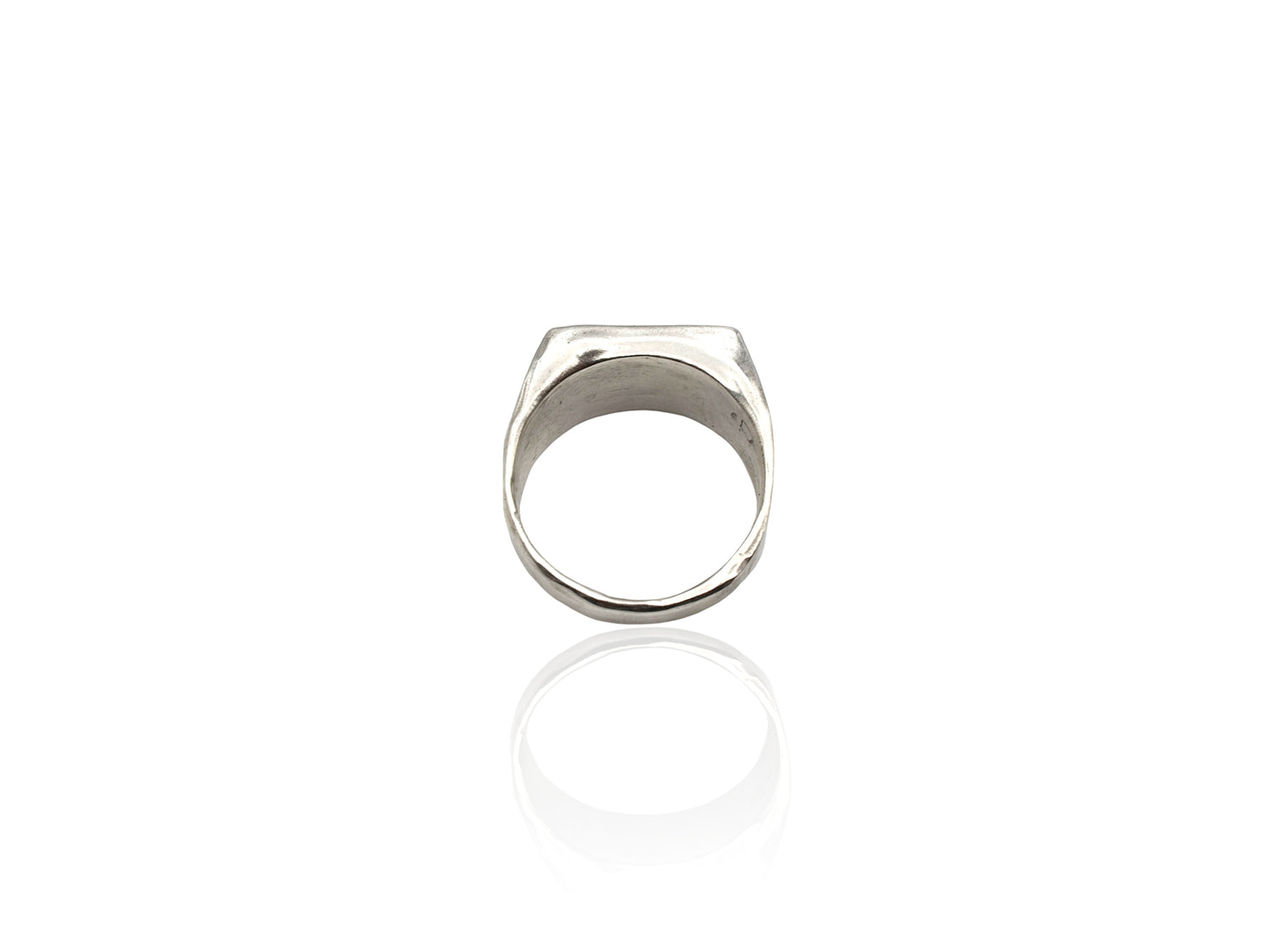 Silver signet ring displayed on white background. silver ring with sculpted organic design and texture. Ring is designed by soul full studio and handmade with lost wax casting and metal smithing techniques.