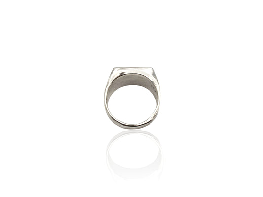 Silver signet ring displayed on white background. silver ring with sculpted organic design and texture. Ring is designed by soul full studio and handmade with lost wax casting and metal smithing techniques.