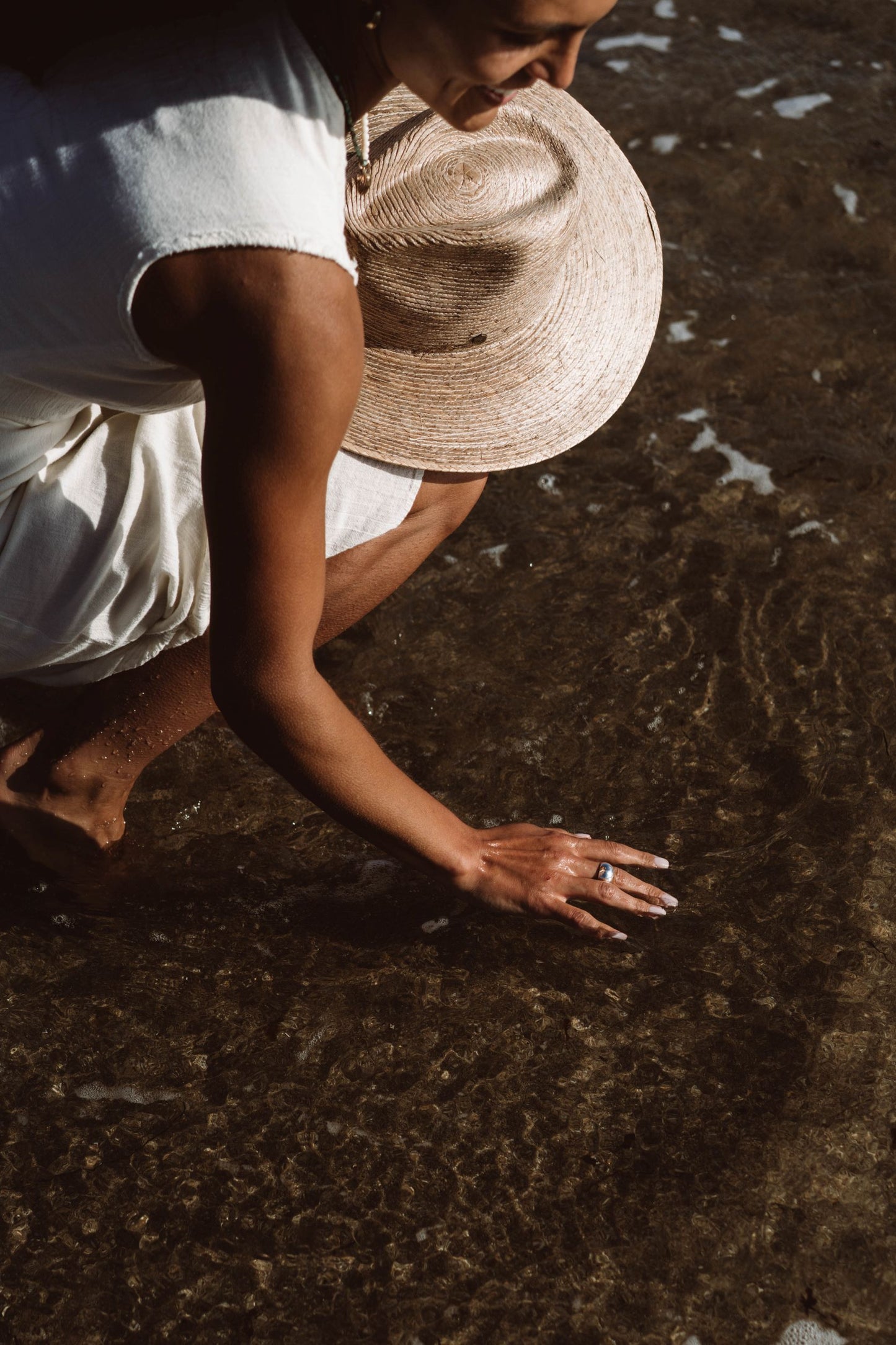 Handcrafted in a dome ring shape, this creation by Soulfull Studio is a product of intricate artistry. Utilizing lost wax casting techniques with recycled silver, it derives its inspiration from the allure of natural elements. Jewelry for the wild ones. Hand model at beach in the ocean.
