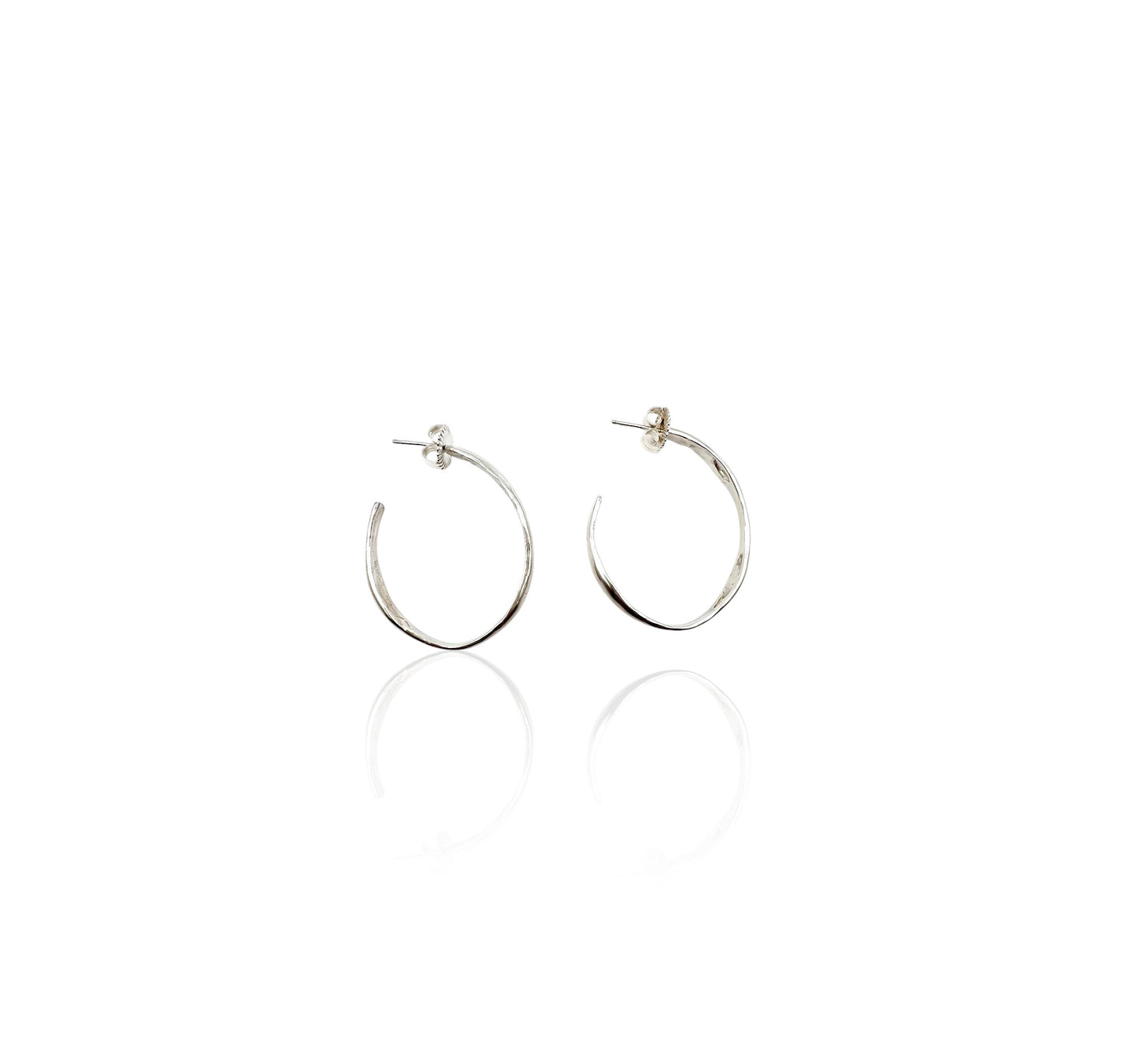 Soul full studio medium silver oval hoops displayed on white background. 