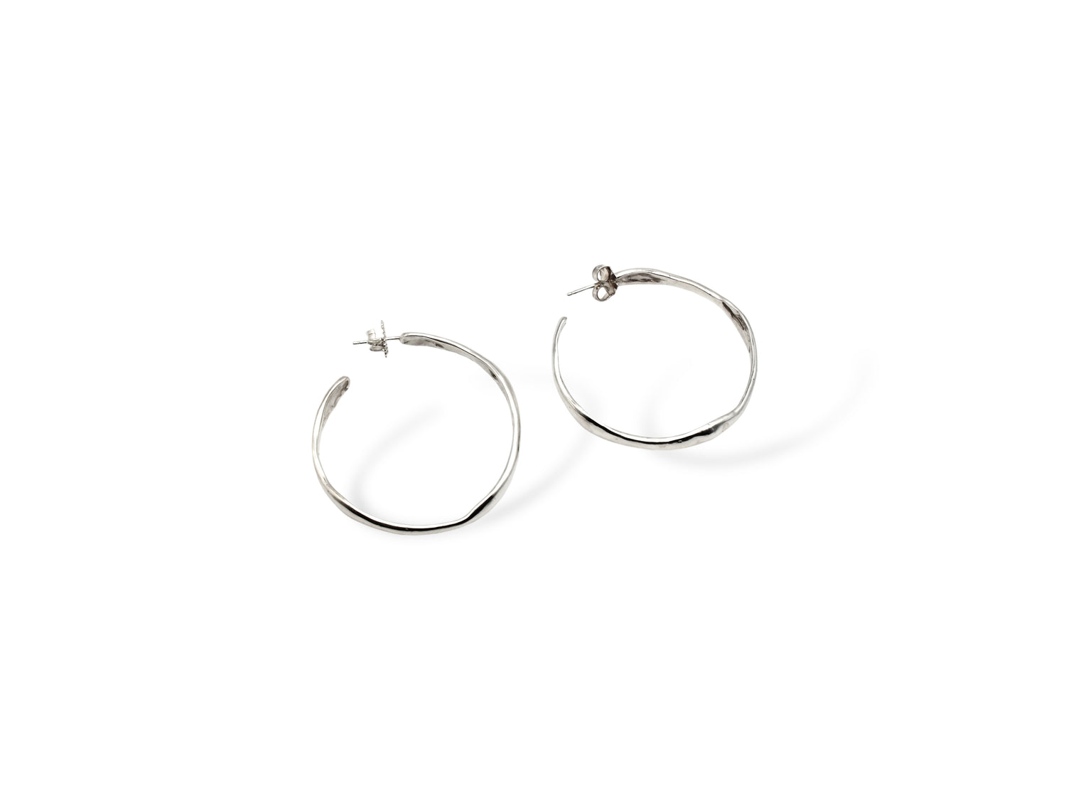 Silver large hoop earrings on white background. Handmade by Soul Full Studio using lost wax cast and metalsmithing techniques. Semifine and fine jewelry. 