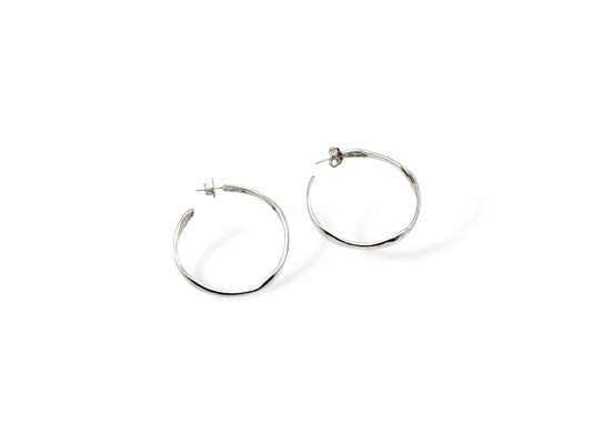 Silver large hoop earrings on white background. Handmade by Soul Full Studio using lost wax cast and metalsmithing techniques. Semifine and fine jewelry. 