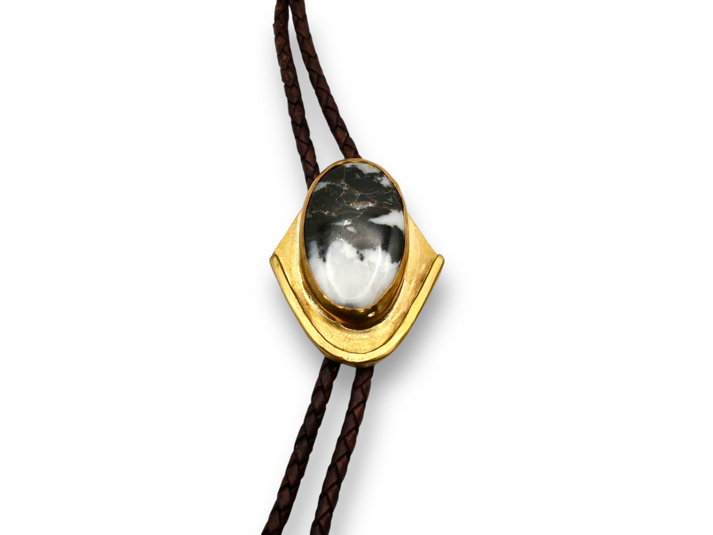 Bolo tie with white buffalo set in brass and brown leather cord. Handmade bolo tie using metal smith techniques.