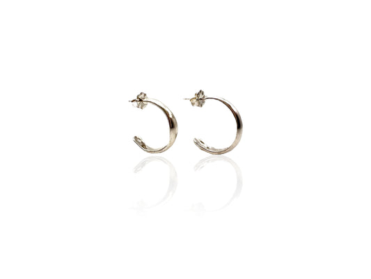 Soul full studio small silver hoops displayed on white background. 