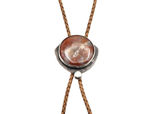 Bolo tie with red moss agate set in sterling silver and tan leather cord. Handmade bolo tie using metal smith techniques. 