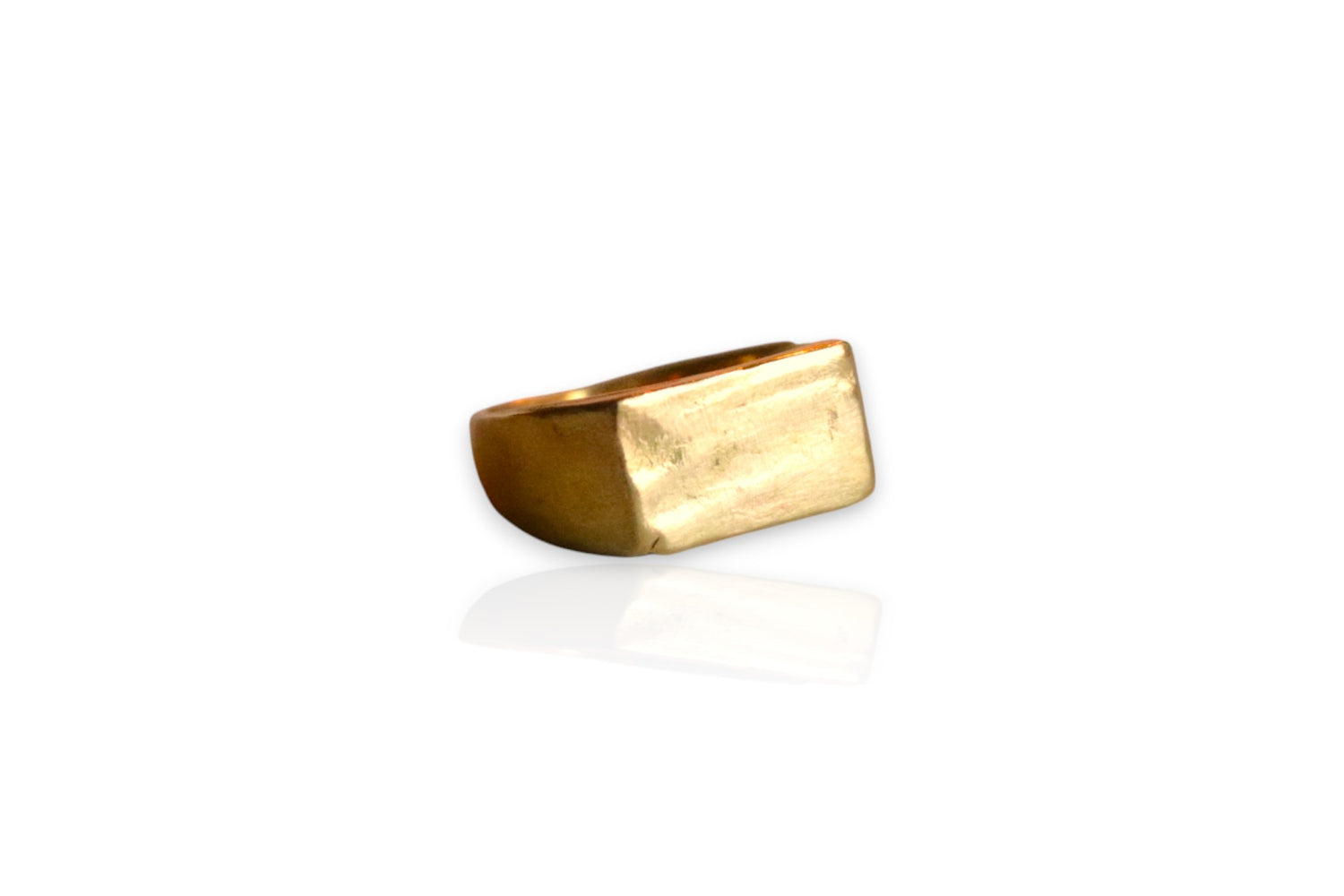 This image displays a yellow brass signet ring with organic, sculpted features. View from the front. Displayed on white background. 
