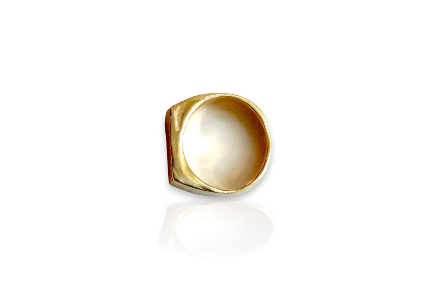 This image displays a yellow brass signet ring with organic, sculpted features.  Image taken from the top view of the ring. Displayed on white background. 