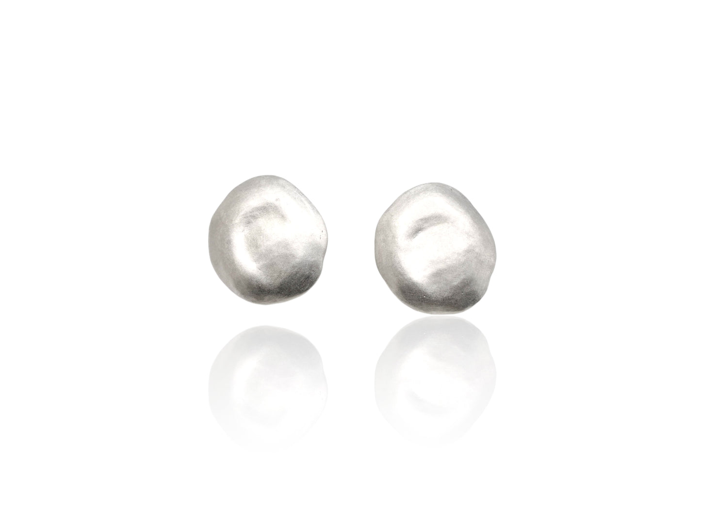 Sky earring in sterling silver on white background. 