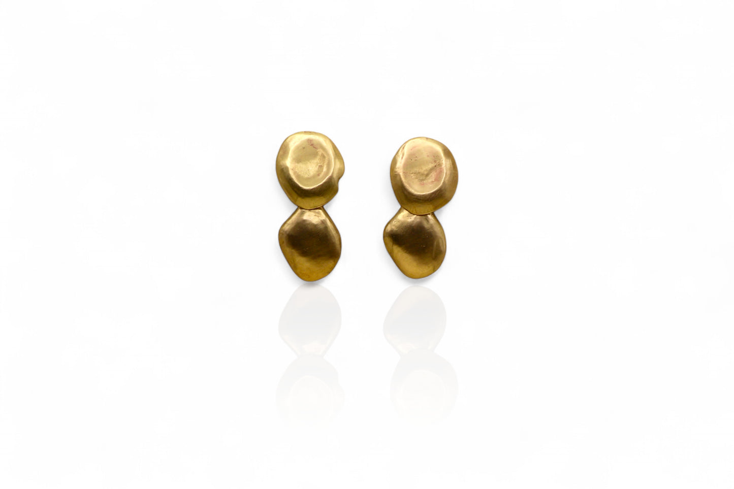 Pair of gold earrings on a white background
