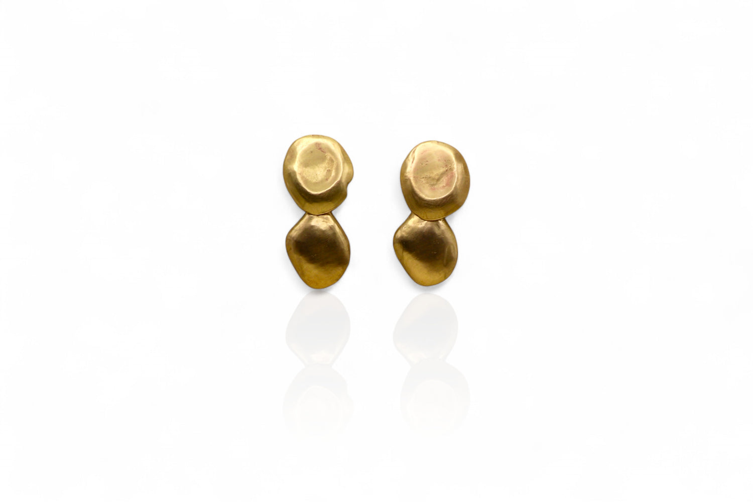 Pair of gold earrings on a white background