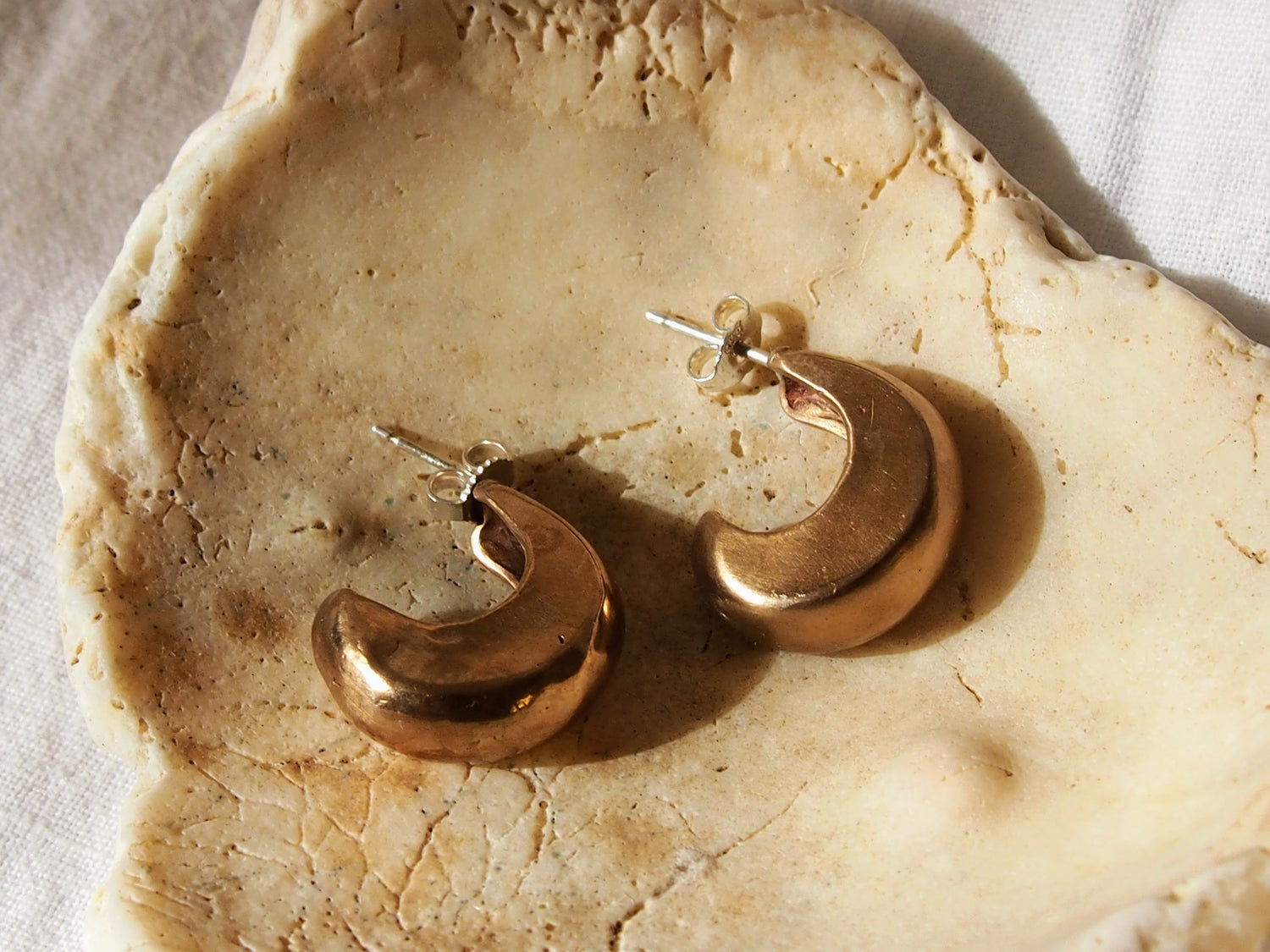 Handcrafted sculpted earrings, meticulously carved using the lost wax casting technique and crafted from recycled bronze. Created by Soulfull Studio. Jewelry for the wild ones. 